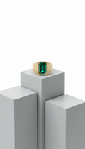 Brushed gold signet ring with emerald